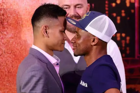 AFP Paulus Ambunda of Namibia and Muhamad Ridhwan of Singapore face off during the Roar of Singapore V - The Kings of Lion City Official Press Conference at Sands Expo & Convention Centre on September 25, 2018 in Singapore.