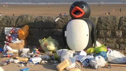 Rob and Claire Curtis Rubbish left on Barry Island beach