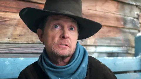 Lil Nas X / YouTube Michael J Fox in the trailer for Lil Nas X's single Holiday