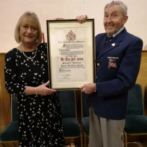 Tameside Council Ron Hill with certificate awarded for Freedom of the Borough of Tameside