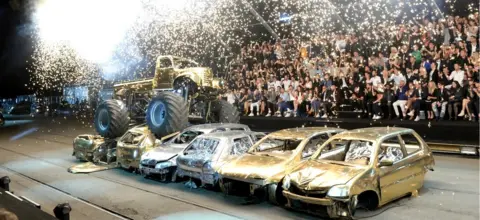 Joe Schildhorn Cars are crushed at a Philipp Plein fashion show