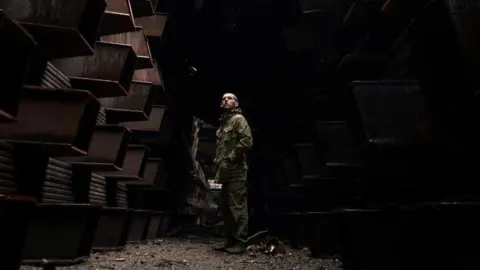 Reuters A Ukrainian soldier at the steelworks in Mariupol