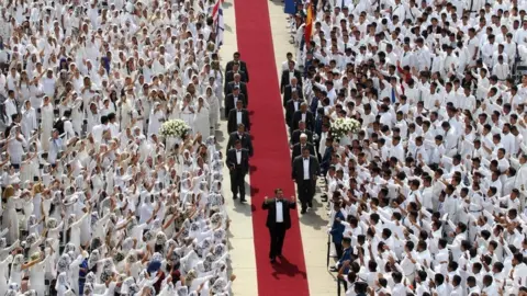 AFP Followers cheer Naáson Joaquín García as he walks down a red carpet