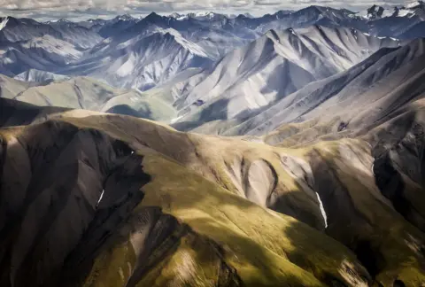 Alain Boudreau Colours fall across mountains.