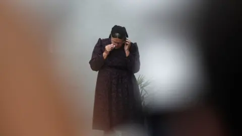 Getty Images The mother of Mennonite farmer Abraham Fehr, who was kidnapped by the Paraguayan People's Army (EPP) guerrilla in 2015 and presumably killed that same year, is seen outside the morgue in Asuncion on January 12, 2018 after his remains were found in a common grave in northern Paraguay