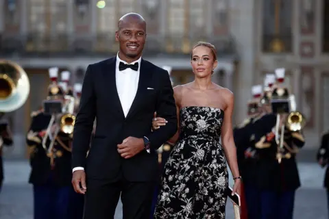 Reuters Didier Drogba and Gabrielle Lemaire arrive to attend the state dinner