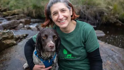 North York Moors National Park Rachel Cripps, a conservation detection dog handler, with Reid the dog