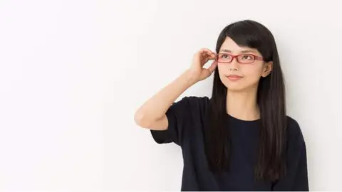 Getty Images Japanese woman wearing glasses