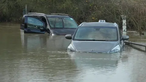 Steve Huntley/BBC Cars stuck in floodwater