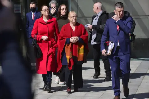 Pacemaker Members of Joe McCann's family and their lawyer leave Belfast Crown Court