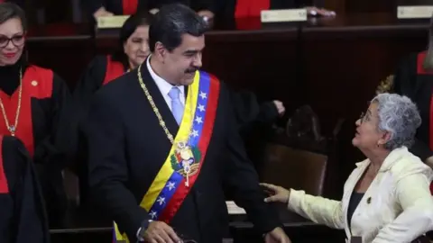 EPA Venezuelan President Nicolas Maduro greets Tibisay Lucena during a ceremony in Caracas, Venezuela, 31 January 202