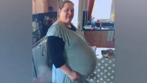 Family photo Katie pregnant with Oscar