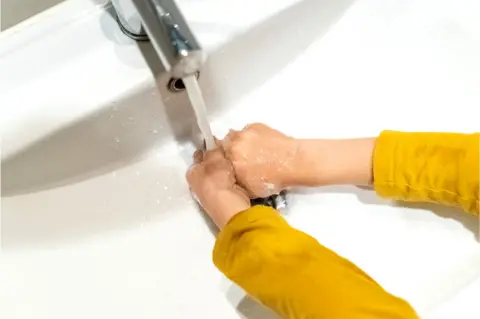 Getty Images Child washing hands