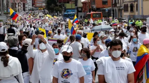 EPA People participate in a march that rejects and calls for the end of the "National Strike" and the violence that arises from the demonstrations against the Government, which completed a month, in Bogota, Colombia, 30 May 2021