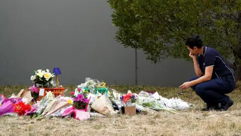 EPA Flowers left in tribute to Aiia Maasarwe