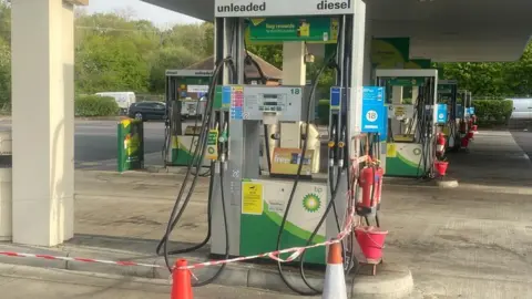 Eddie Mitchell Damaged fuel pump at Clacket Lane services on the M25