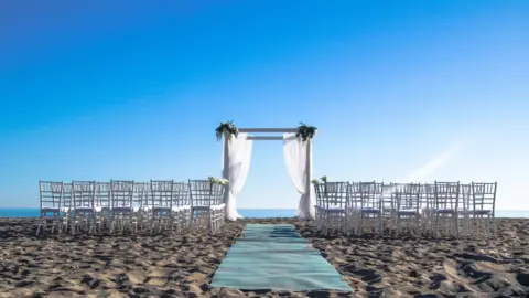 Getty Images Stock image of a beach wedding venue