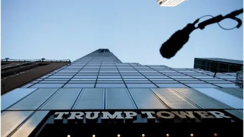 Getty Images A boom microphone hangs overhead during a protest against Republican presidential candidate Donald Trump for his treatment of women, in front of Trump Tower on October 17, 2016 in New York City