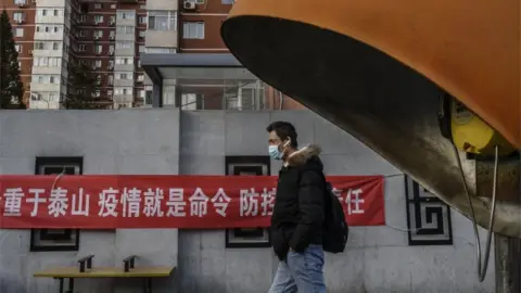 Getty Images Man in mask in Beijing