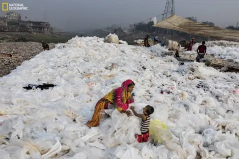 Randy Olson Clear plastic sheeting being spread out to dry in Bangladesh