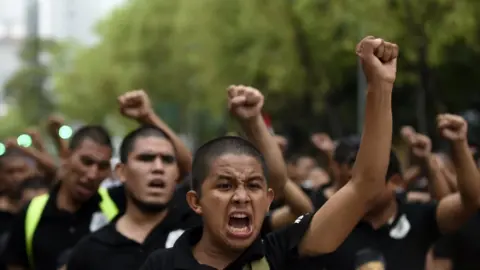 AFP Students and activists take part in a demonstration to mark the fourth anniversary of the disappearance of 43 students of the teaching training school in Ayotzinapa, in Mexico City, on September 26, 2018.