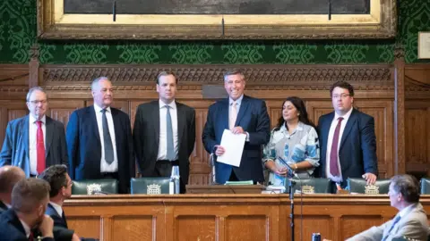PA Media Sir Graham Brady (4th from left) chairman of the 1922 Committee, announces in the Houses of Parliament, which MPs have gained the support of the 20 MPs required to go into the Conservative Party leadership contest