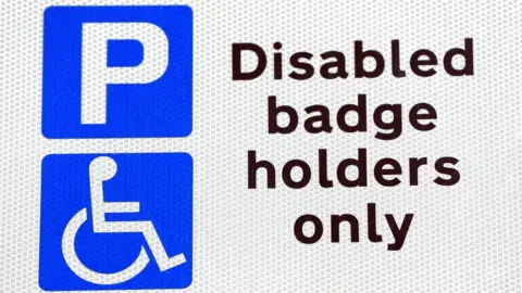 Jonathan Brady Blue badge parking sign