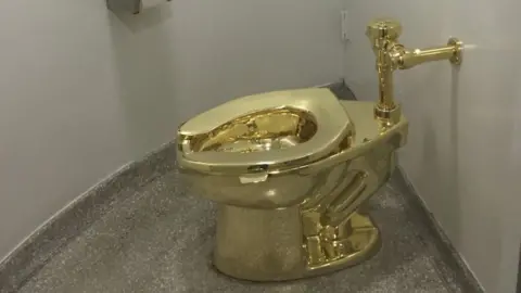 AFP/Getty Images Gold toilet by Maurizio Cattelan