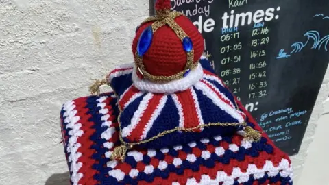 Rita Hubbard Knitted red crown on Union Jack cushion