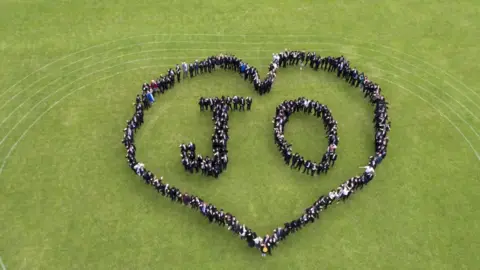 The Challenge/PA Pupils at Cockshut Hill School in Birmingham form a heart-shaped human chain and spell out the words ÔJoÕ to mark the Great Get Together weekend in memory of MP Jo Cox.