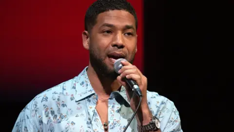 Getty Images Jussie speaking on stage