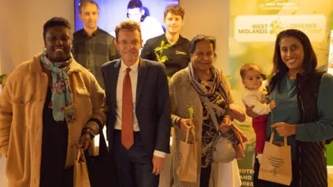 WMCA Andy Street and people collecting trees