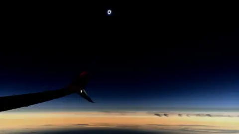 JAMES COOK/BBC Solar eclipse seen from an Alaska Airlines flight, 21 August 2017