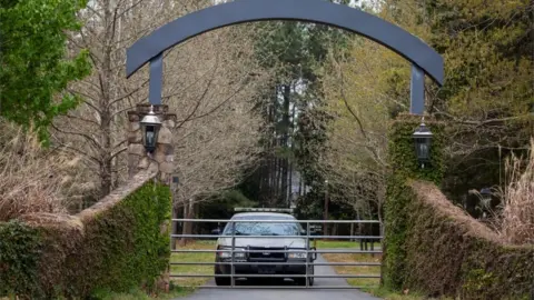 Getty Images Sheriff officials guard the home where the shooting occured