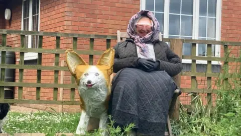 PA Media Queen and Corgi scarecrow