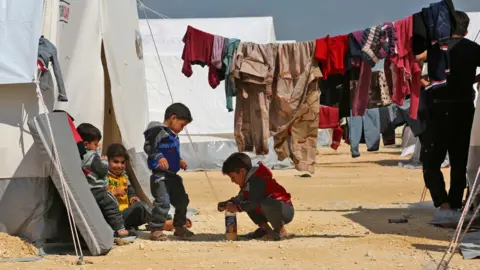 AFP Children play at a camp for displaced Syrians in al-Bil