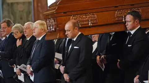 PA Media Boris Johnson at funeral service