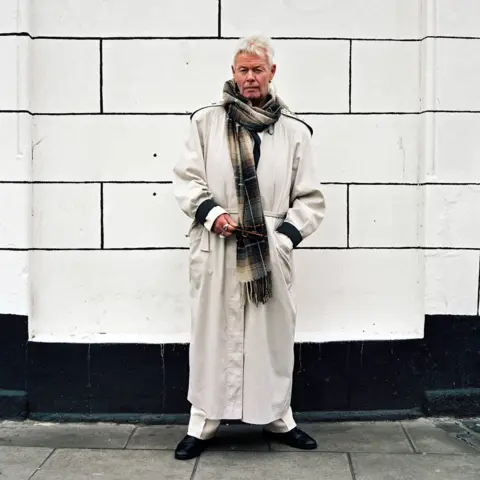 Ilya Ilford Man in a long white coat