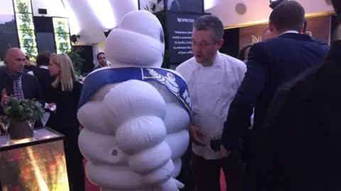 Michelin Man mingles with the guests