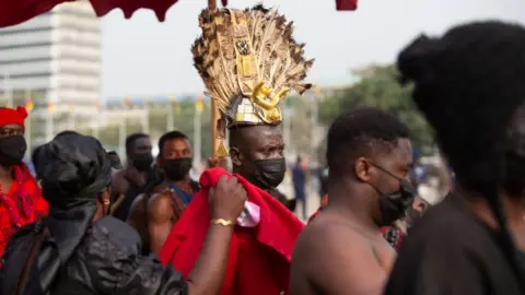 Getty Images Traditional leaders arrive at the final funeral rites of the former Ghana President Jerry John Rawlings in Accra, Ghana, on January 27, 2021. - Former Ghana President Jerry John Rawlings died in November 2020 at the age of 73 and his funeral was initially scheduled for December 23, 2020 but was postponed, due to what the foreign ministry called "unforeseen circumstances".