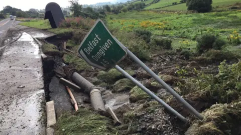 John O'Neill A fallen sign pointing the way to Belfast and Dungiven