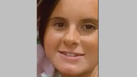 Family photo A close-up picture of Destiney Rauh smiling at the camera and wearing a checked shirt