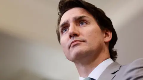 Reuters Justin Trudeau holds a press conference in response to the release of a special report on foreign interference,