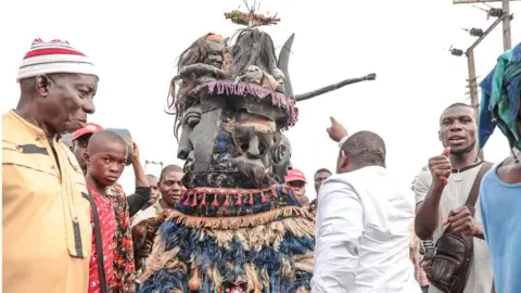 BBC Man in a masquerade costume in Arondizuogu during the Ikeji Festival in Nigeria