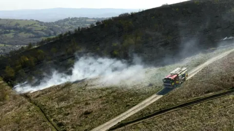 Nathan Collins A fire engine is seen at Machen mountain at the scene of a grass fire