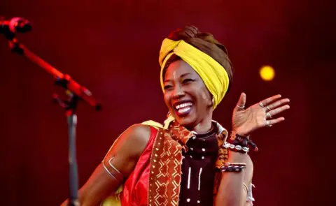 AFP Malian singer-songwriter and actress Fatoumata Diawara feat. Yael Naim performs on the Orange Stage during the Roskilde music festival in Roskilde, Denmark, on July 1, 2022.
