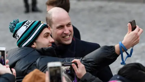 AFP/Getty Images Prince William poses for a selfie