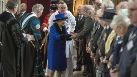 PA The Queen hands out Maundy money