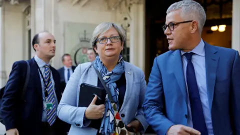 Getty Scottish National Party (SNP) MP Joanna Cherry (C) and Jolyon "Jo" Maugham QC (R) leave the Supreme Court in central London, on the second day of the hearing into the decision by the government to prorogue parliament on September 18, 2019.