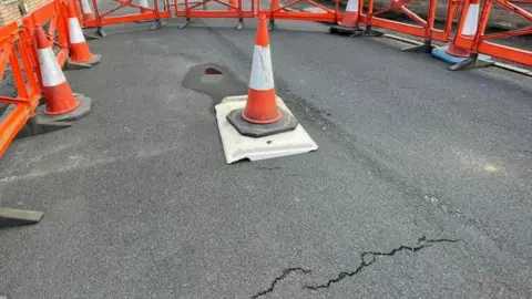 Terry-Harris.com Traffic cone over sinkhole